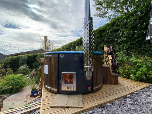 Wood fired hot tub with - , grade